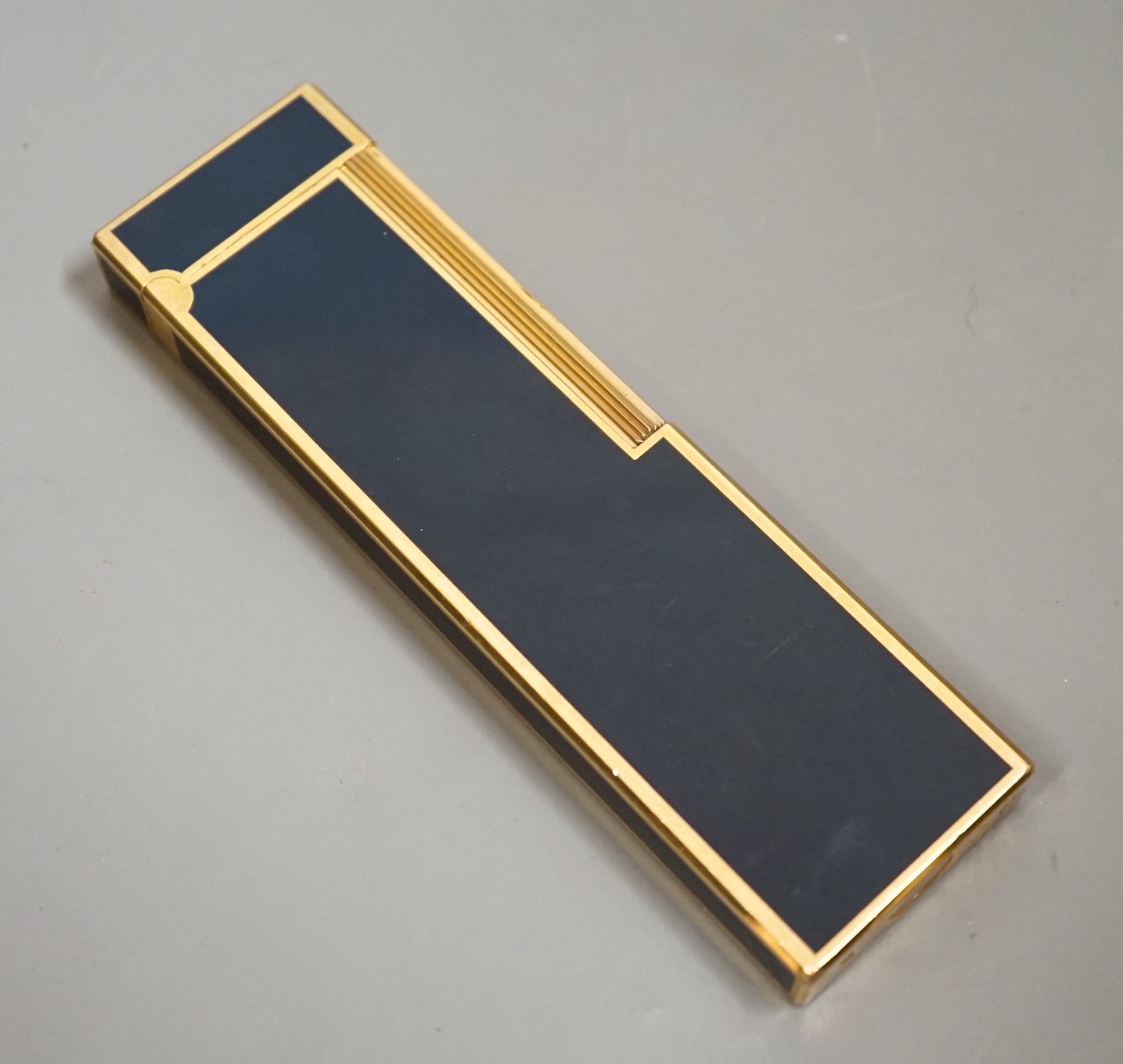 A Dupont gilt metal and blue enamel table lighter signed in Japanese, 14cm